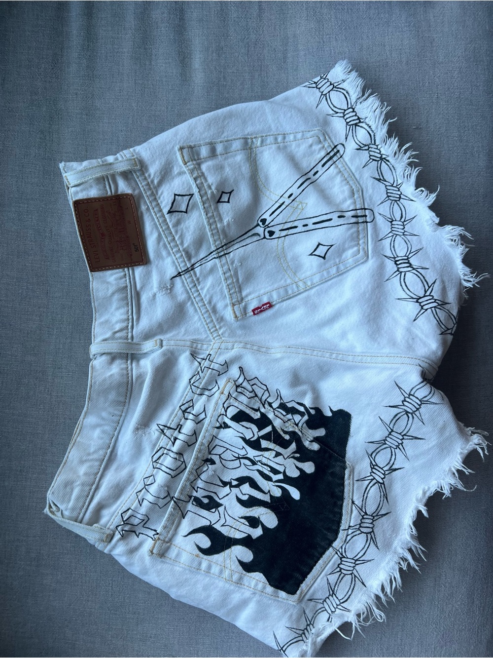Levi's White Denim Shorts with Black Butterfly Motif - Picture 2 of 5